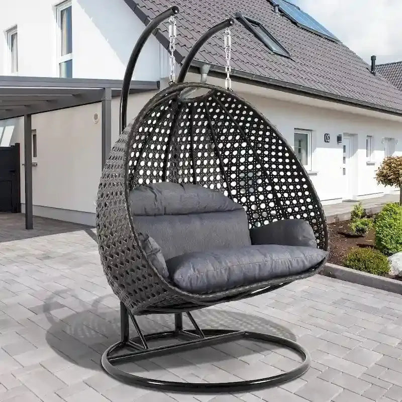 LeisureMod 2-Person Hanging Egg Chair – Indoor/Outdoor Rattan Wicker Swing with Stand and Cushioned Lounger